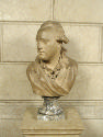 Alternate view of a terracotta bust of Peter Adolf Hall. He looks over to his right, and has a …