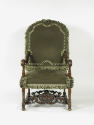 Photograph taken from the front of a green armchair