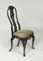 Walnut frame chair with carved back and upholstered seat