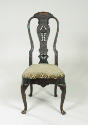 Alternate view of walnut frame chair with carved back and upholstered seat 