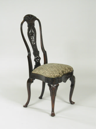 Walnut frame chair with carved back and upholstered seat