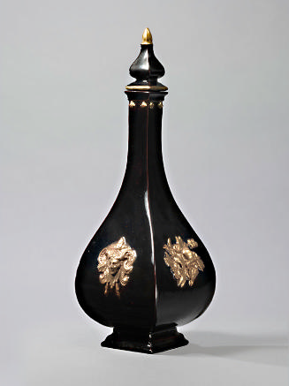 Black-glazed porcelain four-sided bottle with stopper.