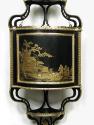 Close-up of Black-and Gold panel on a Hanging Corner Cabinet