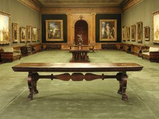 Walnut table with supports in the form of scrolls and lion's-paw feet