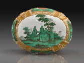 Underside of brush handle showing a galant scene in green glaze surrounded by gilding