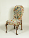 Chair with needlepoint upholstery of vegetal decoration, birds, and flowers