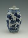 Blue and white porcelain candle taper, decorated in floral pattern.