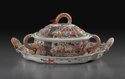 White porcelain lidded tureen on a tray decorated with fish handles and Chinese scenes and patt…