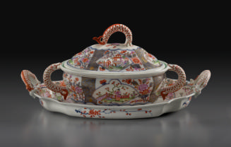 White porcelain lidded tureen on a tray decorated with fish handles and Chinese scenes and patt…