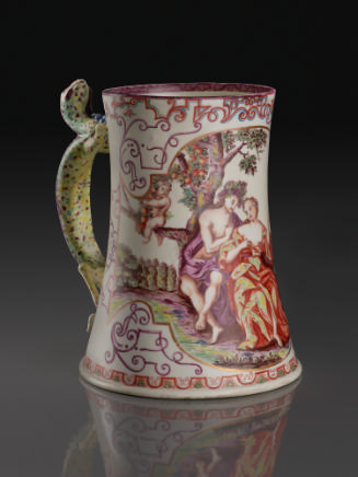 White porcelain tankard with a green lizard handle decorated with classical scenes