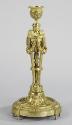 Gilt bronze candlestick with cherub heads and swags of garland