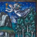 Angel in flight carrying a chalice 