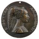 Bronze portrait medal of Isotta degli Atti wearing an elaborate headdress in profile to the rig…