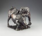 Alternate view of a bronze sculpture of a leopard attacking a bull.  The leopard is actively cl…