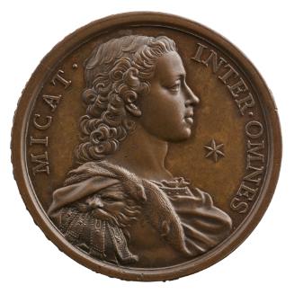 Bronze portrait medal of Prince Charles of England as young man, wearing classical-style armor …