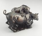 Alternate view of a bronze sculpture of a leopard attacking a bull.  The leopard is actively cl…