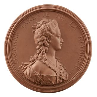 Terracotta medal of a woman in profile to the right wearing a dress with ample décolletage