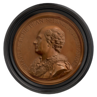 Terracotta medal of a man with short hair in profile to the left, wearing a coat, chemise, and …